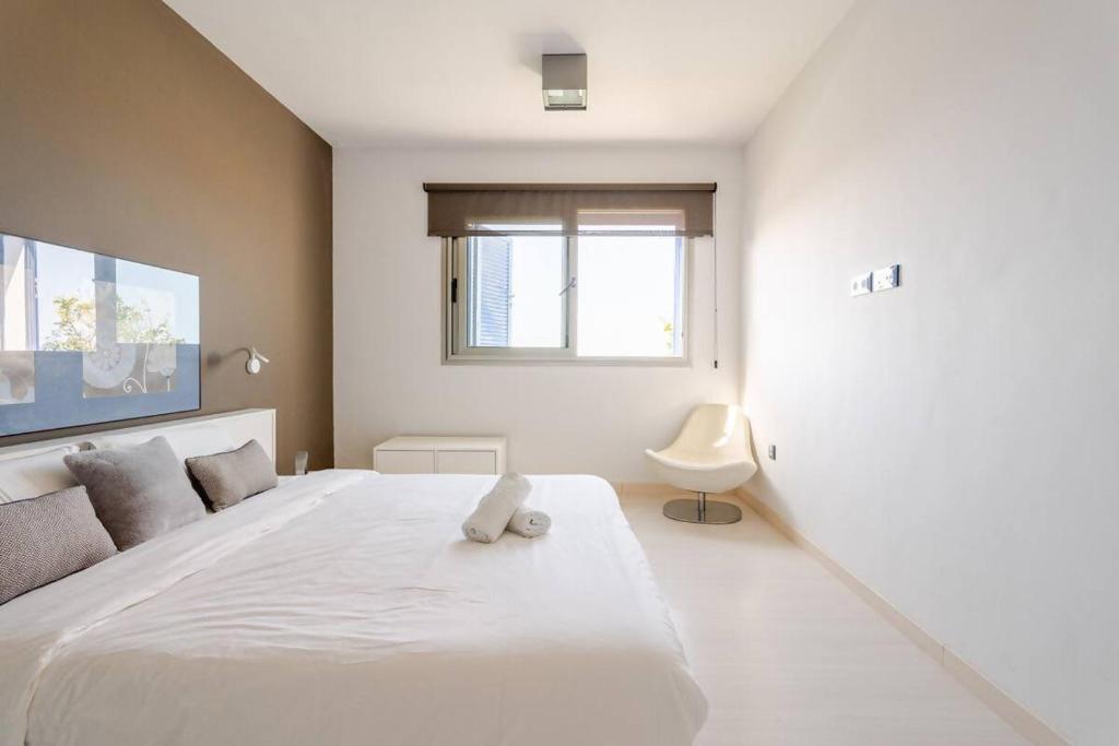 Postel nebo postele na pokoji v ubytování Villa Itaca Vista mar y piscina climatizada