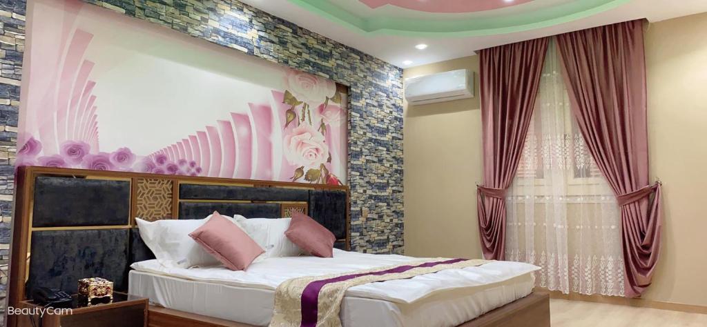 Postel nebo postele na pokoji v ubytování JubingeHotel 聚滨阁民宿