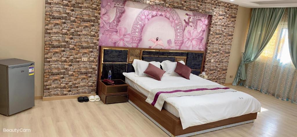 Postel nebo postele na pokoji v ubytování JubingeHotel 聚滨阁民宿