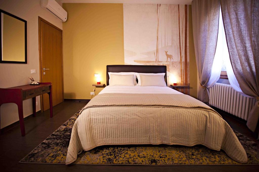 Postel nebo postele na pokoji v ubytování B&b Igea 50
