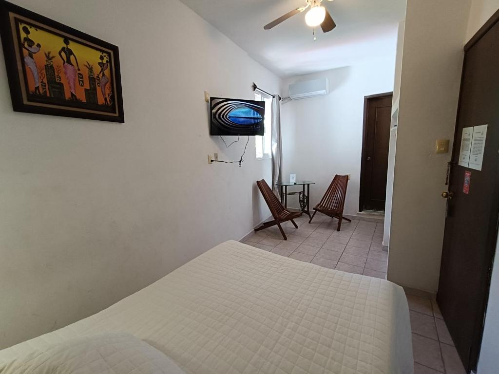 Postel nebo postele na pokoji v ubytování Hotel Rath