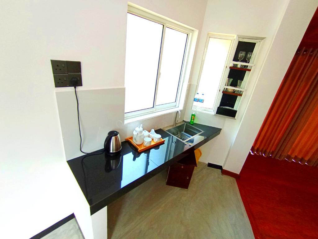 Kuchyň nebo kuchyňský kout v ubytování Thusara Guesthouse