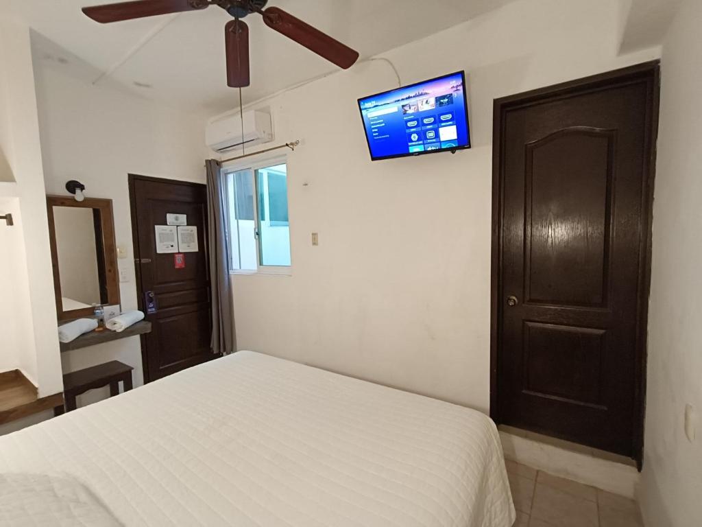 Postel nebo postele na pokoji v ubytování Hotel Rath