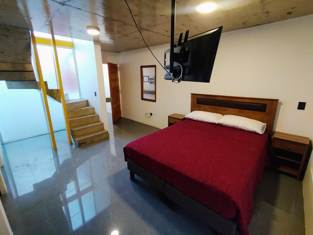 Postel nebo postele na pokoji v ubytování Puerto Enrique Apart-Hotel