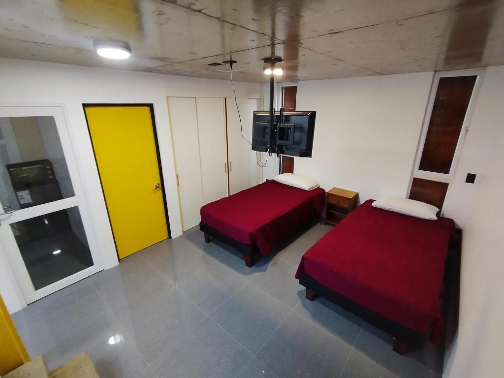 Postel nebo postele na pokoji v ubytování Puerto Enrique Apart-Hotel