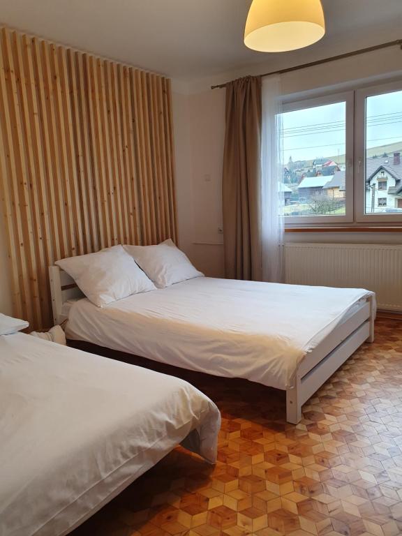 Postel nebo postele na pokoji v ubytování Spiski Apartament