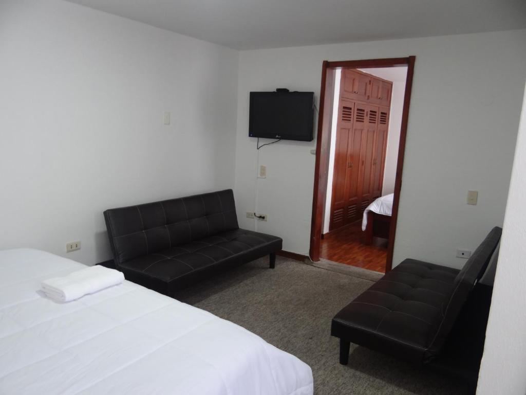 TV a/nebo společenská místnost v ubytování Altura Rooms & Suites