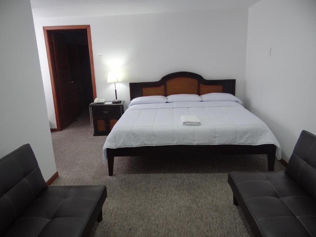 Postel nebo postele na pokoji v ubytování Altura Rooms & Suites