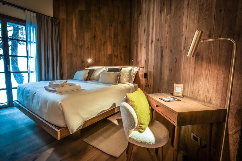 Postel nebo postele na pokoji v ubytování Hotel al Piolet