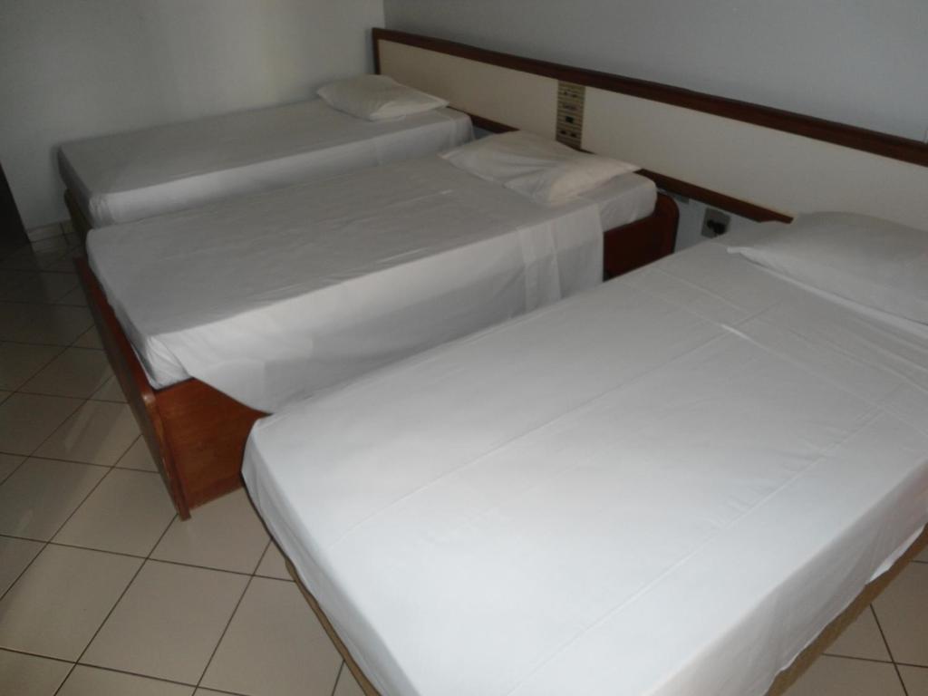Cama ou camas em um quarto em Flat Garvey Apart-hotel