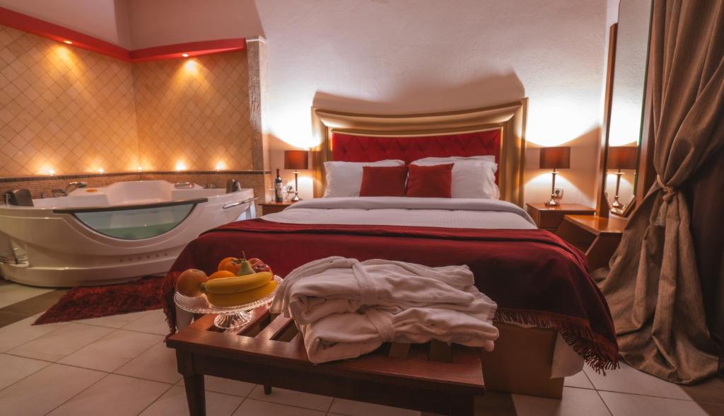 A bed or beds in a room at Asteras Hotel