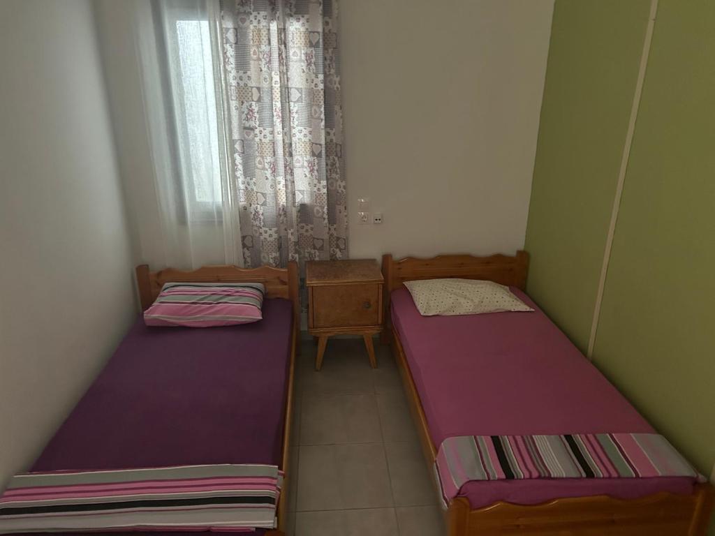 Postel nebo postele na pokoji v ubytování Lemonia