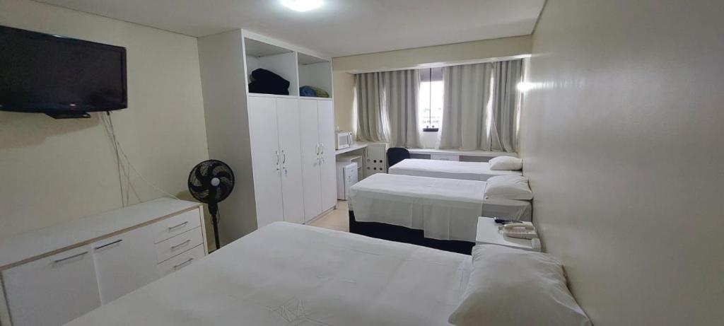 Cama ou camas em um quarto em Flat Garvey Apart-hotel
