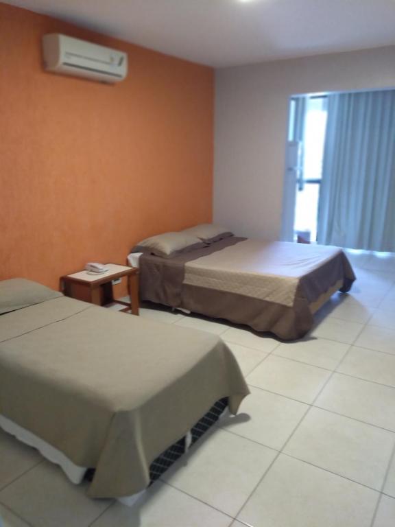 Cama ou camas em um quarto em Flat Garvey Apart-hotel