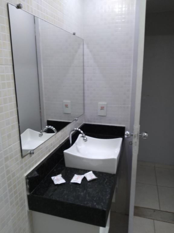 Um banheiro em Flat Garvey Apart-hotel