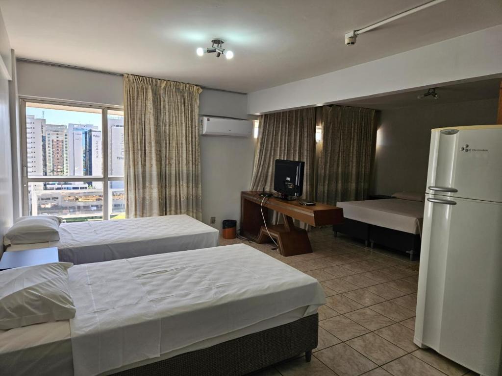 Cama ou camas em um quarto em Flat Garvey Apart-hotel