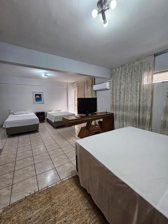 Cama ou camas em um quarto em Flat Garvey Apart-hotel