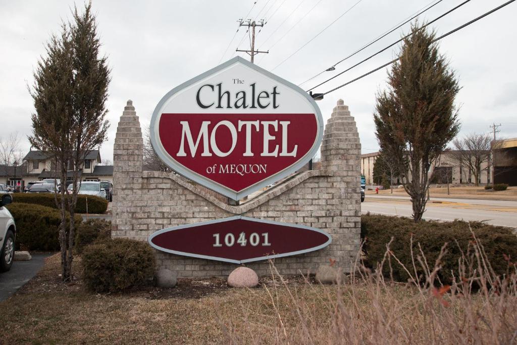 a sign for the chalker motel of mercy at The Chalet Motel in Mequon