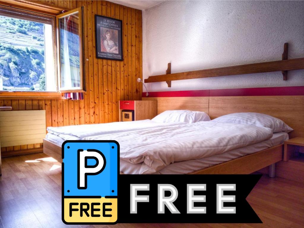 Postel nebo postele na pokoji v ubytování Hotel du Stand