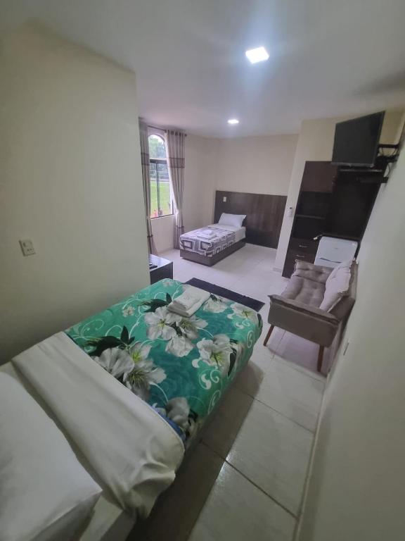 Postel nebo postele na pokoji v ubytování Hotel Villa
