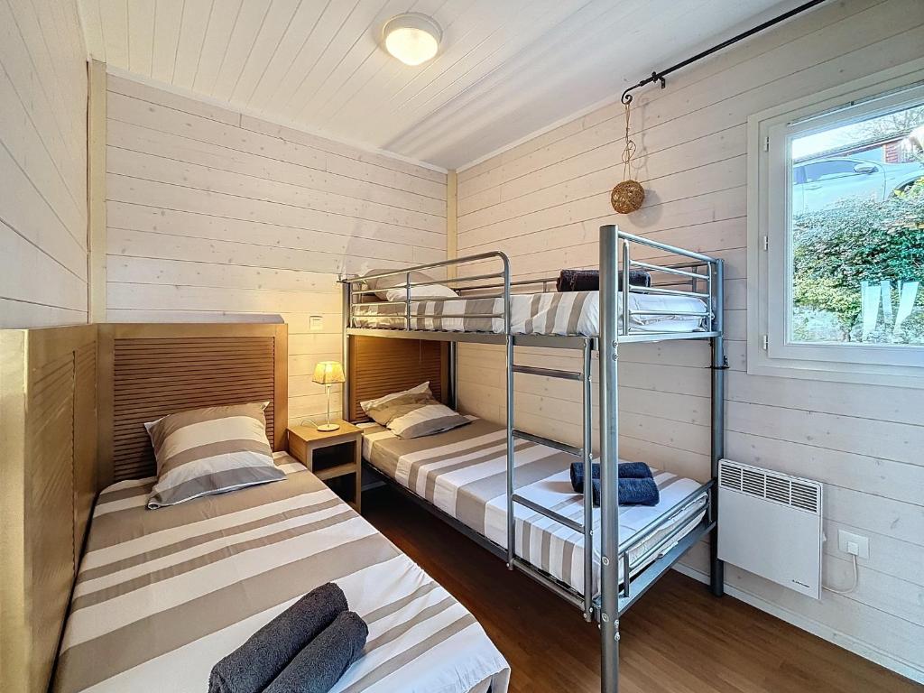 Postel nebo postele na pokoji v ubytování Chalet de la Butte aux Cerfs