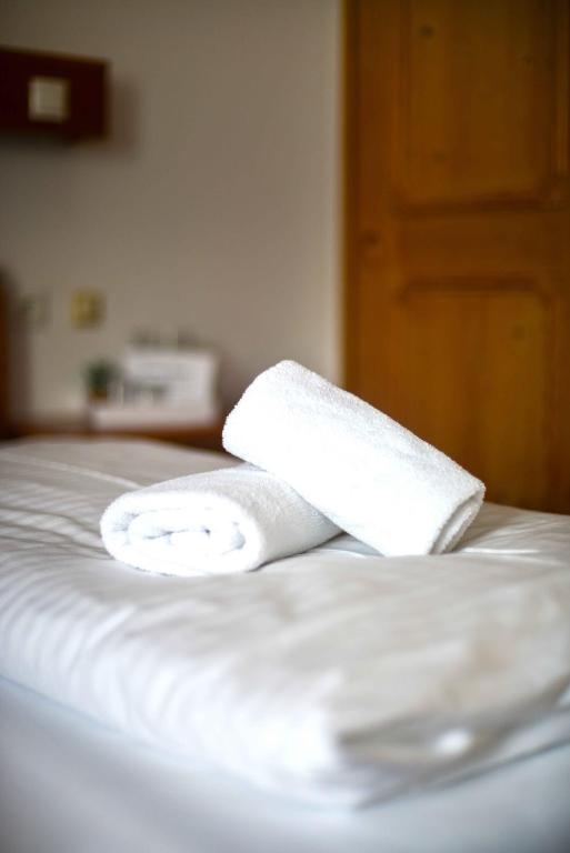 Postel nebo postele na pokoji v ubytování Hotel Andreas Hofer