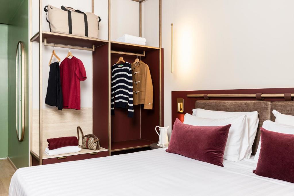 Postel nebo postele na pokoji v ubytování Adoro Hotel
