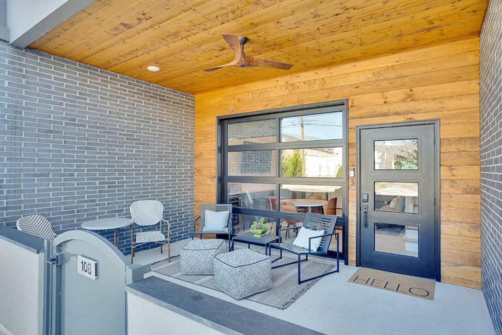 a patio with chairs and a table and a ceiling at Main Street Retreat Chatt in Chattanooga