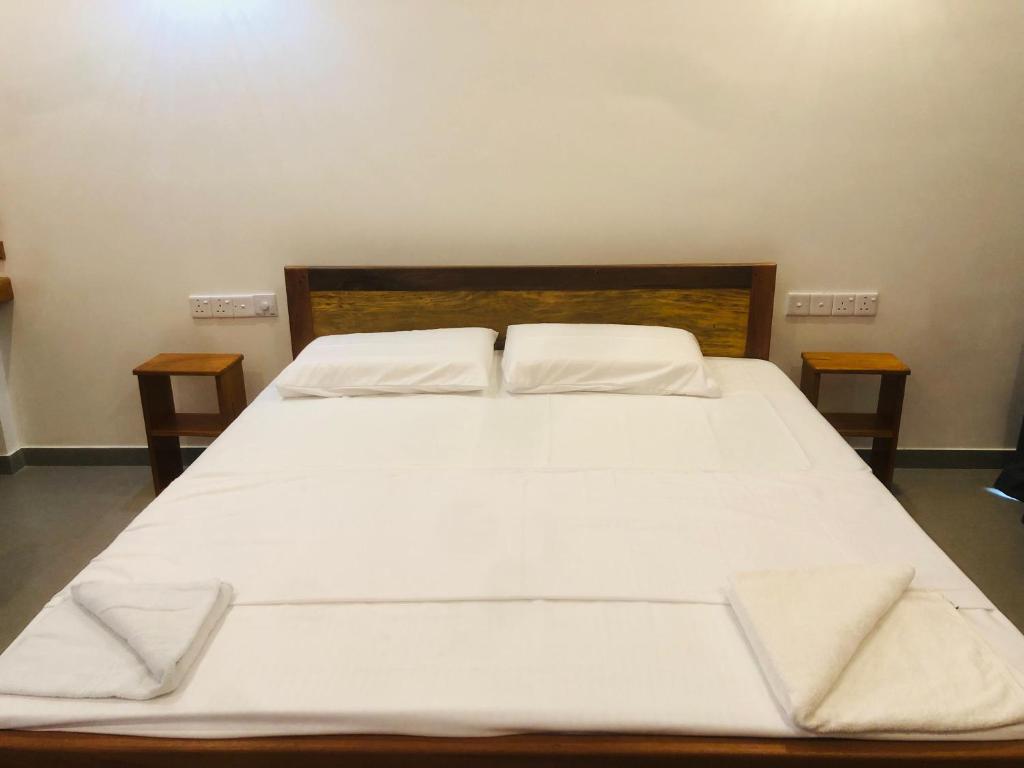 Postel nebo postele na pokoji v ubytování HIRI Fortress