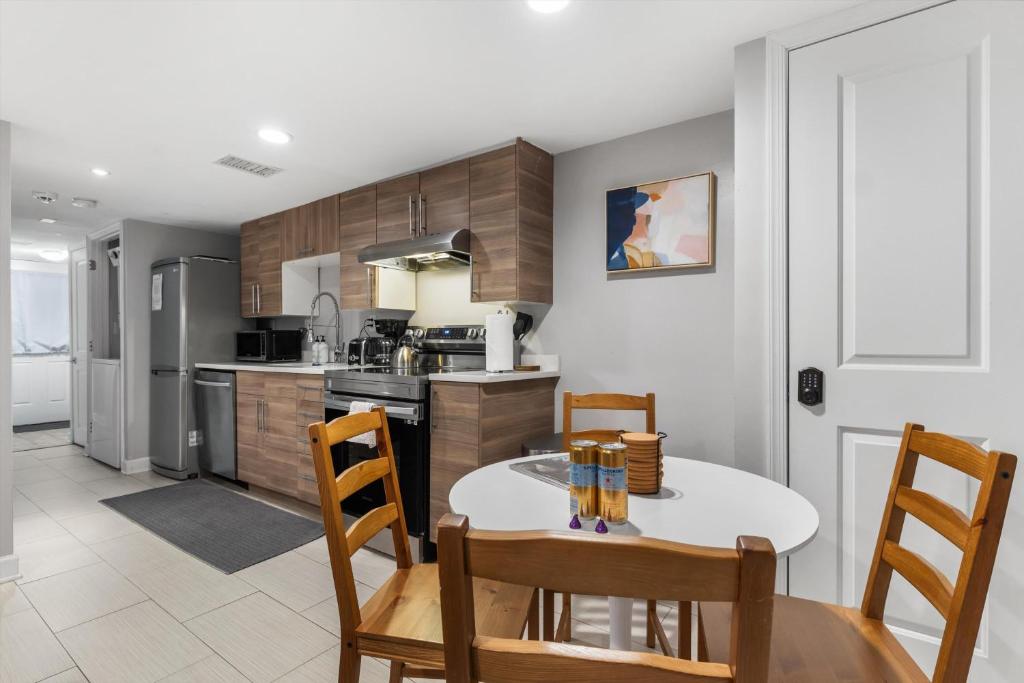 a kitchen and dining room with a table and chairs at Walk to Parks Restaurants Monuments & More in Washington, D.C.