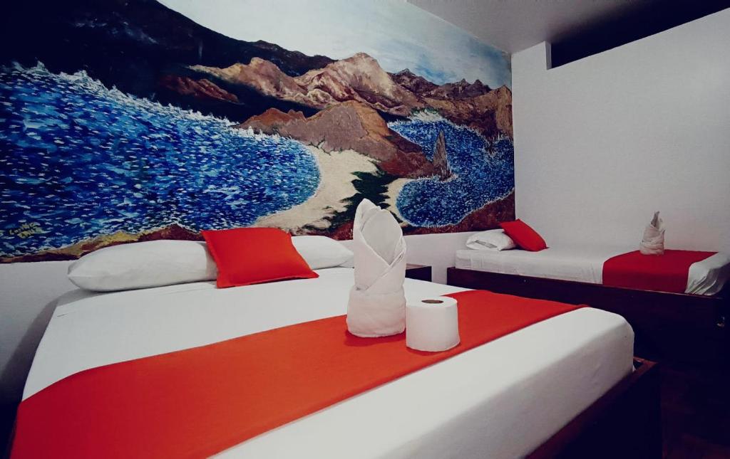 Postel nebo postele na pokoji v ubytování Hostal El Pinzón