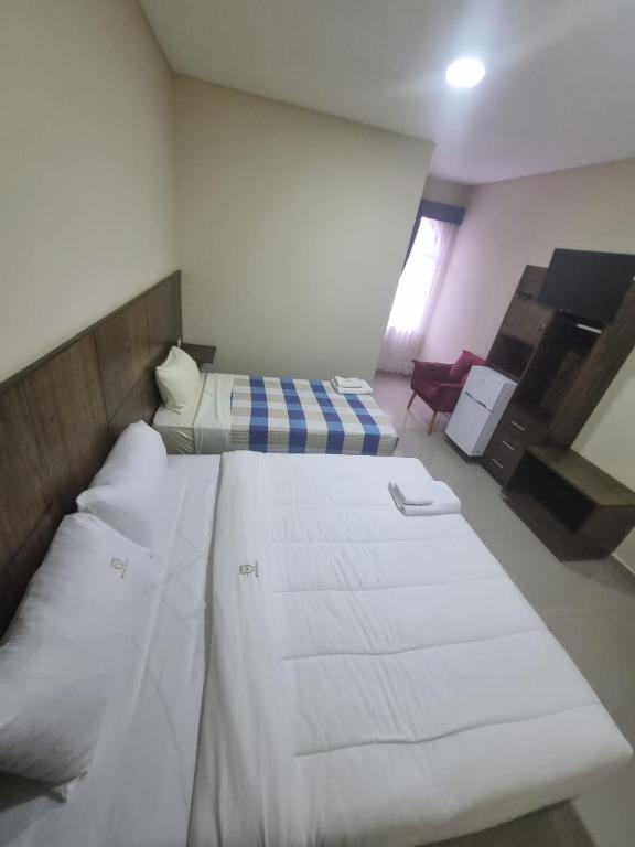 Postel nebo postele na pokoji v ubytování Hotel Villa