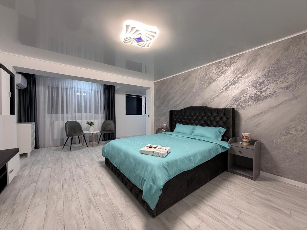 En eller flere senge i et værelse på WPP Apartament