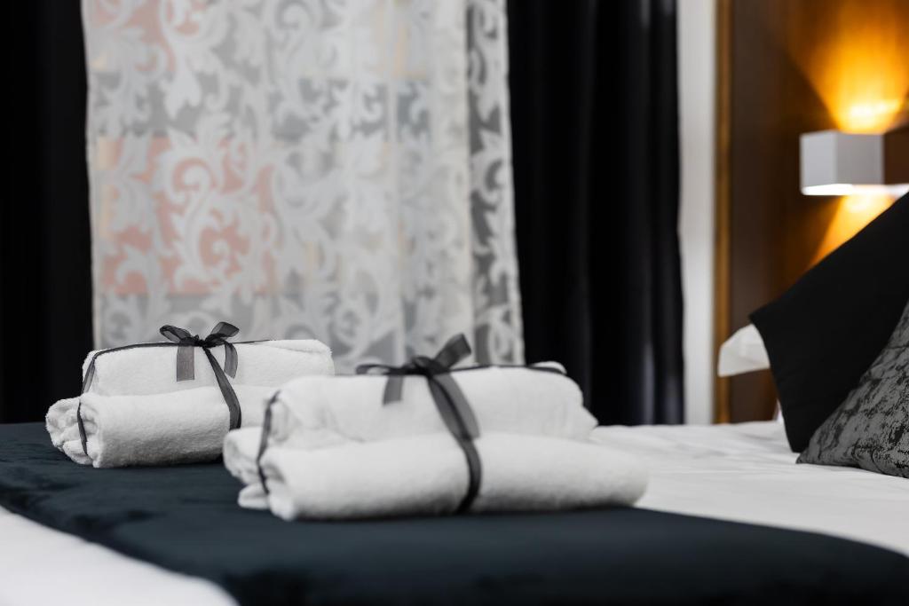 Postel nebo postele na pokoji v ubytování Hotel Max