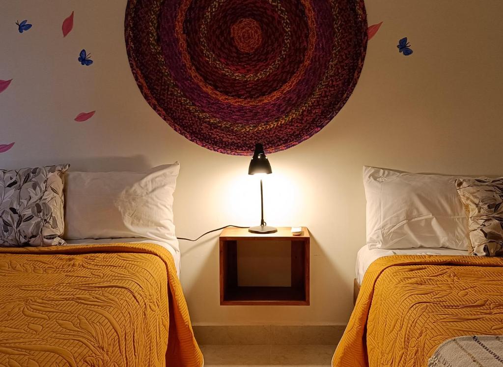 Llit o llits en una habitació de VALLADOLID 48 Hotel & Hostal