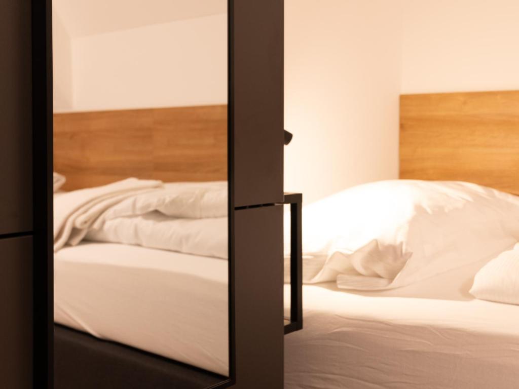 Postel nebo postele na pokoji v ubytování Brauhaus-Hotel König von Flandern