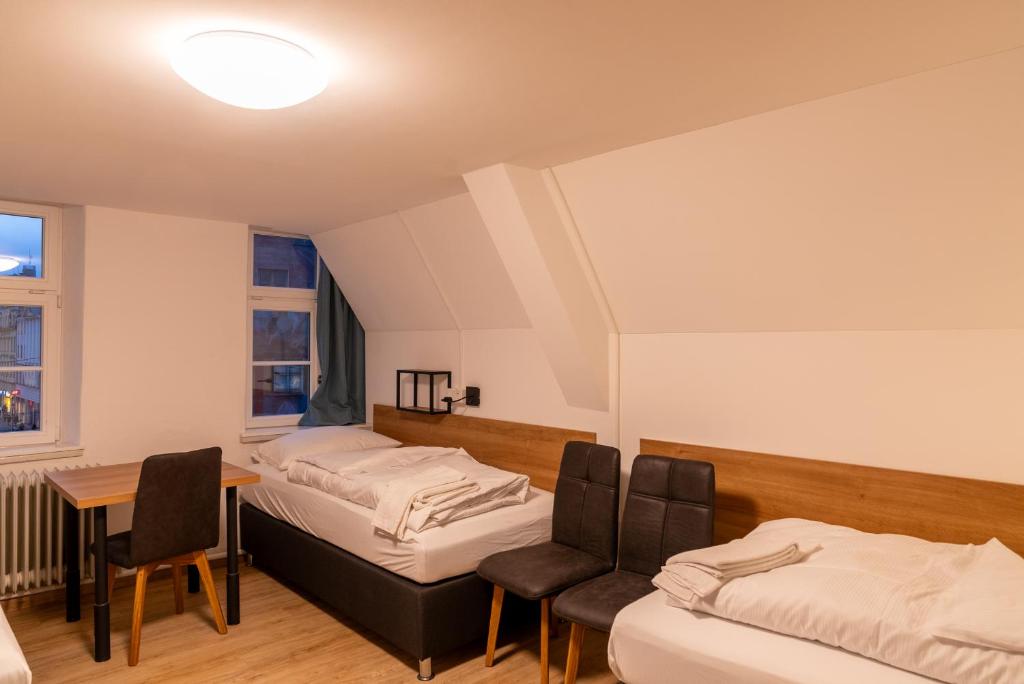 Postel nebo postele na pokoji v ubytování Brauhaus-Hotel König von Flandern
