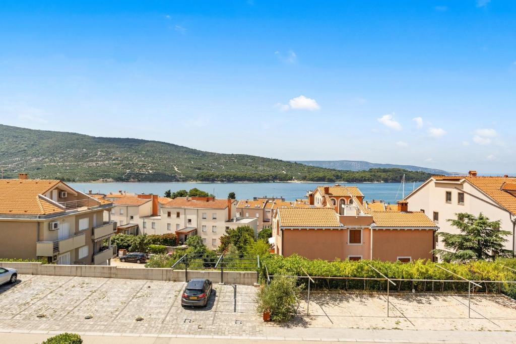 a view of a town with a body of water at Apartments Jana & Paula in Cres