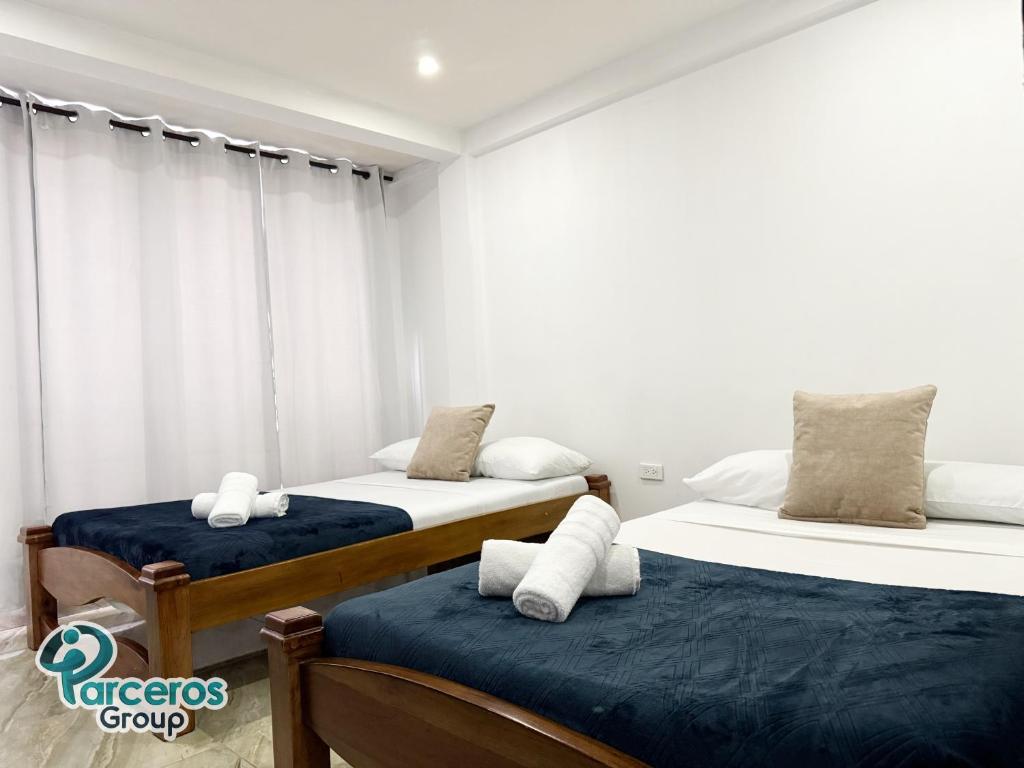 Postel nebo postele na pokoji v ubytování Apartamentos Amoblados En La Circunvalar Cerca a Parque Arboleda y Parque La Rebeca, Por Parceros Group