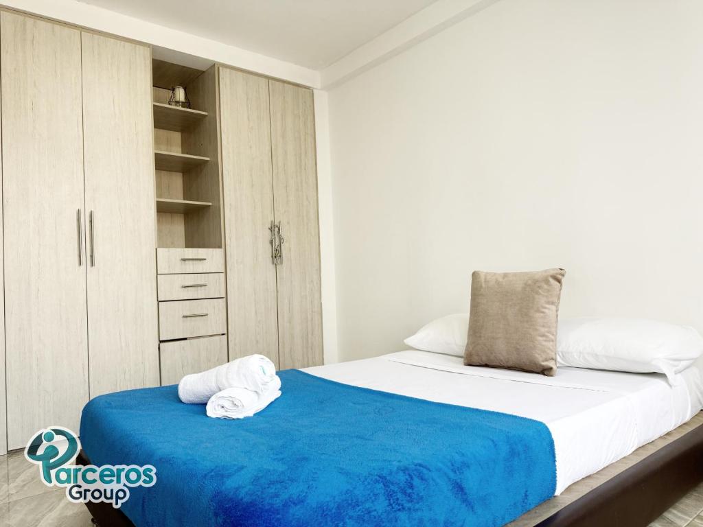 Postel nebo postele na pokoji v ubytování Apartamentos Amoblados En La Circunvalar Cerca a Parque Arboleda y Parque La Rebeca, Por Parceros Group