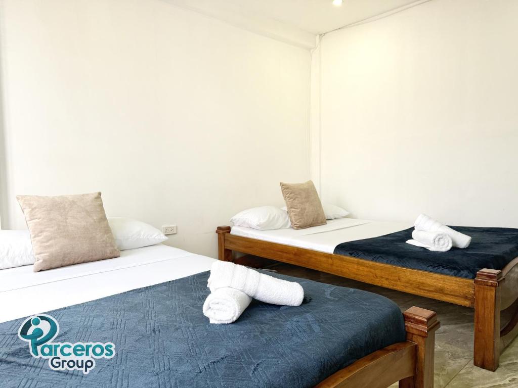 Postel nebo postele na pokoji v ubytování Apartamentos Amoblados En La Circunvalar Cerca a Parque Arboleda y Parque La Rebeca, Por Parceros Group