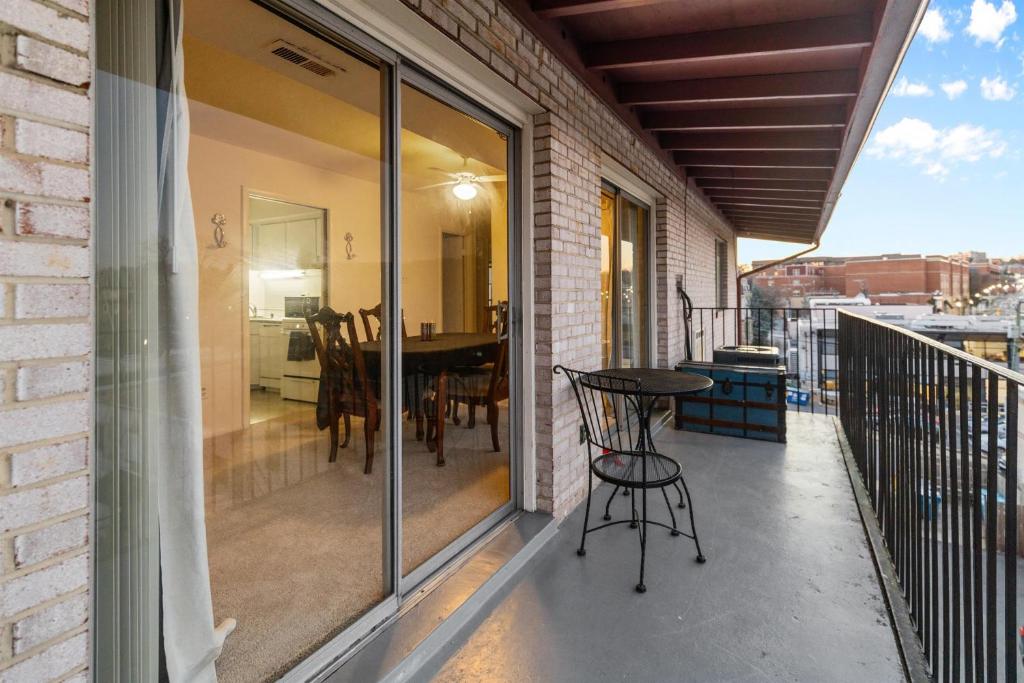 a balcony with a table and chairs on it at Your perfect stay - Cozy 2BR apartment in NOVA in Arlington