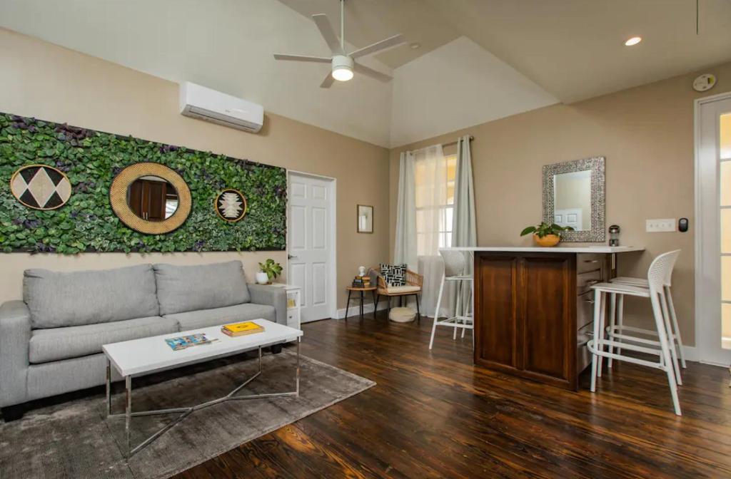 a living room with a couch and a table at The Moko Jumbie House - Premier Suite in Christiansted