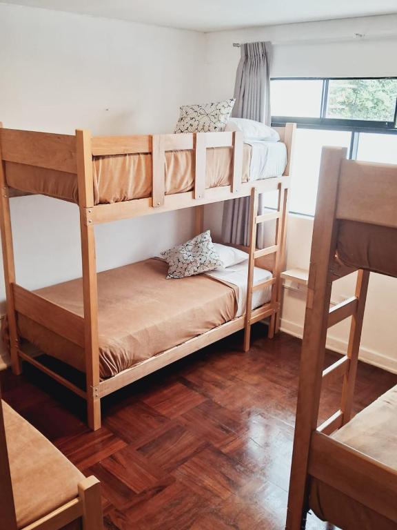 Postel nebo postele na pokoji v ubytování Temazcal Hostel