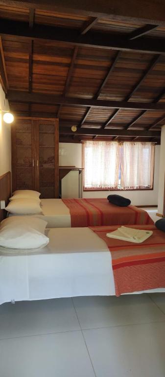 Postel nebo postele na pokoji v ubytování Pitanga Ilha Grande