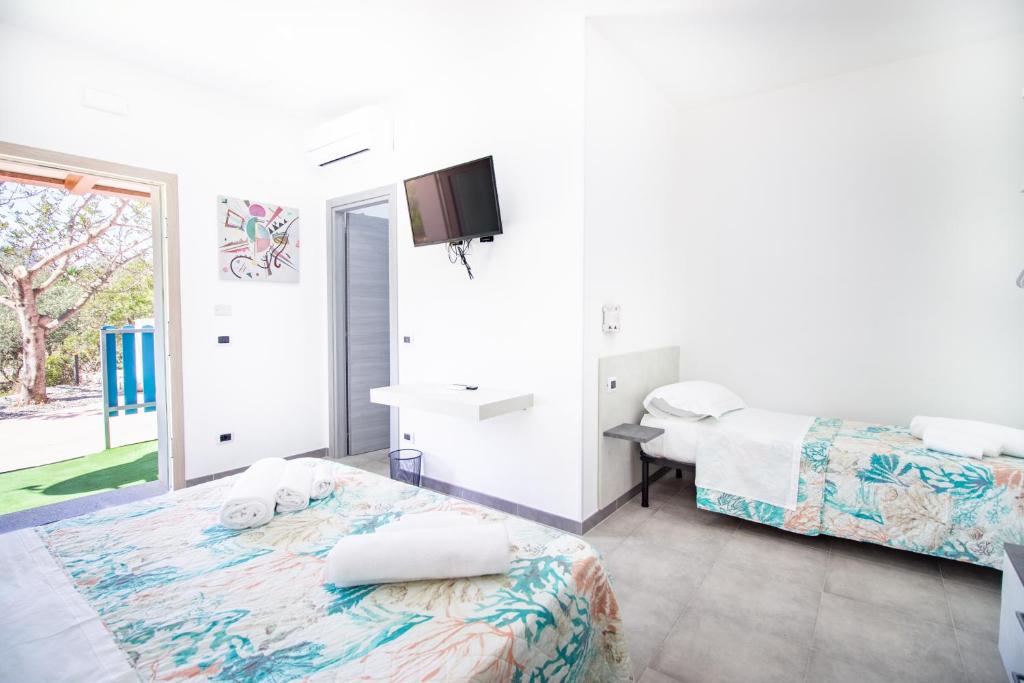 Postel nebo postele na pokoji v ubytování S'Omu e Chicchinu Rooms