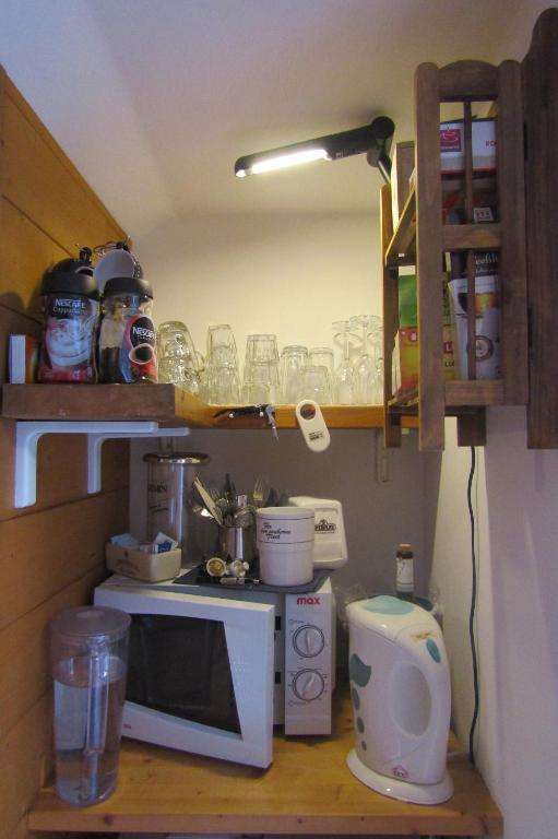 Kuchyň nebo kuchyňský kout v ubytování Room & Breakfast Cà mea Dina
