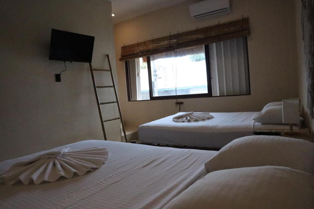 Postel nebo postele na pokoji v ubytování 3B Wellness Hotel & Hostel Adults Only