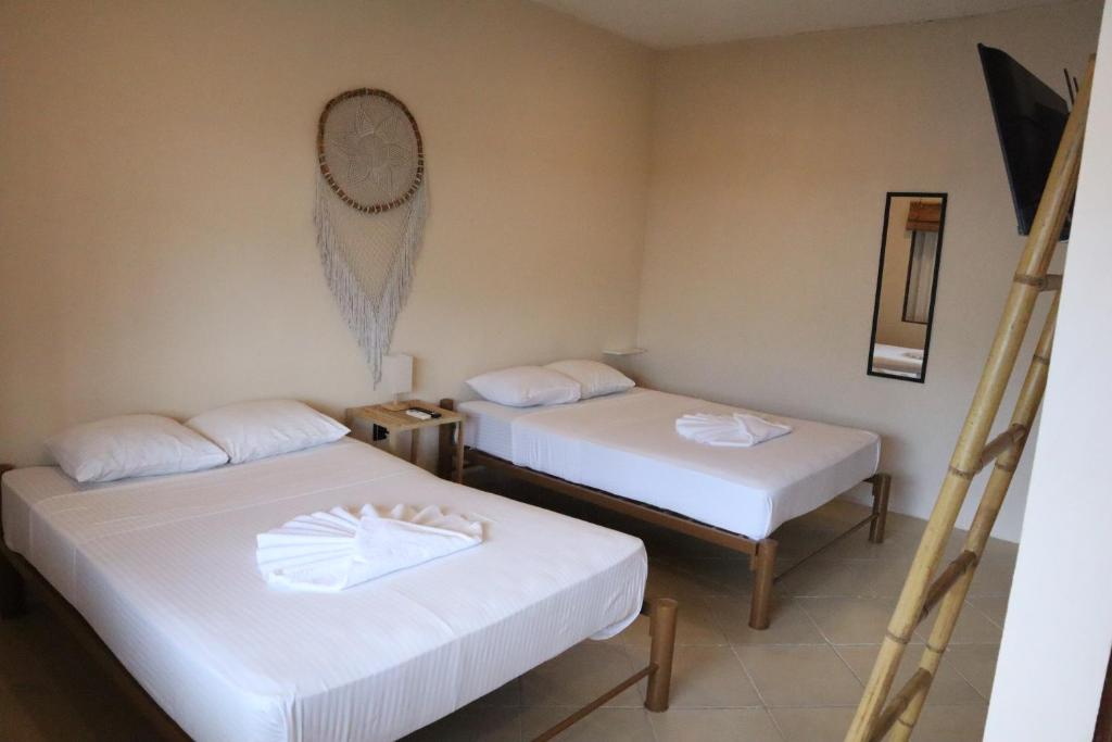 Postel nebo postele na pokoji v ubytování 3B Wellness Hotel & Hostel Adults Only
