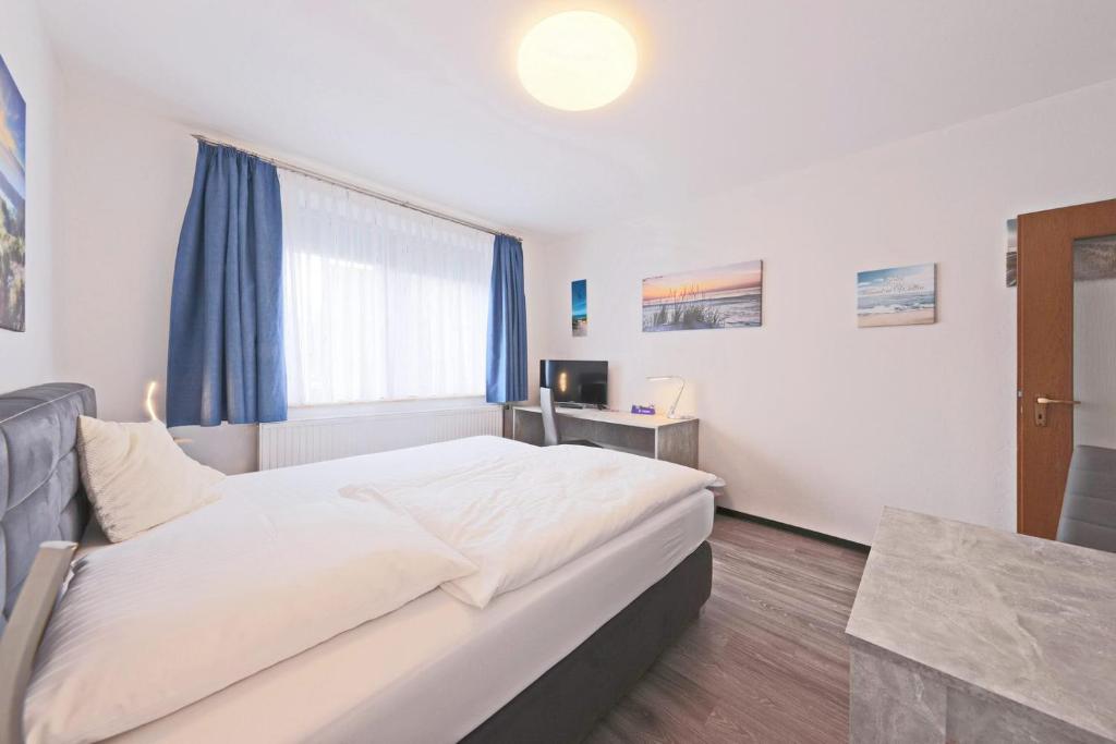 Postel nebo postele na pokoji v ubytování Hotel Hülsmann Garni